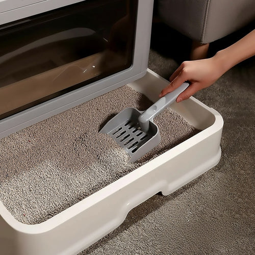 Bac à litière pliable pour chat Esprit Chat en plastique gris et blanc avec tiroir de rangement et pelle.