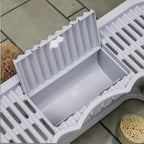 Bac à litière pliable gris en plastique pour chat, avec tiroir coulissant et brosse de massage intégrée. Marque Esprit Chat.