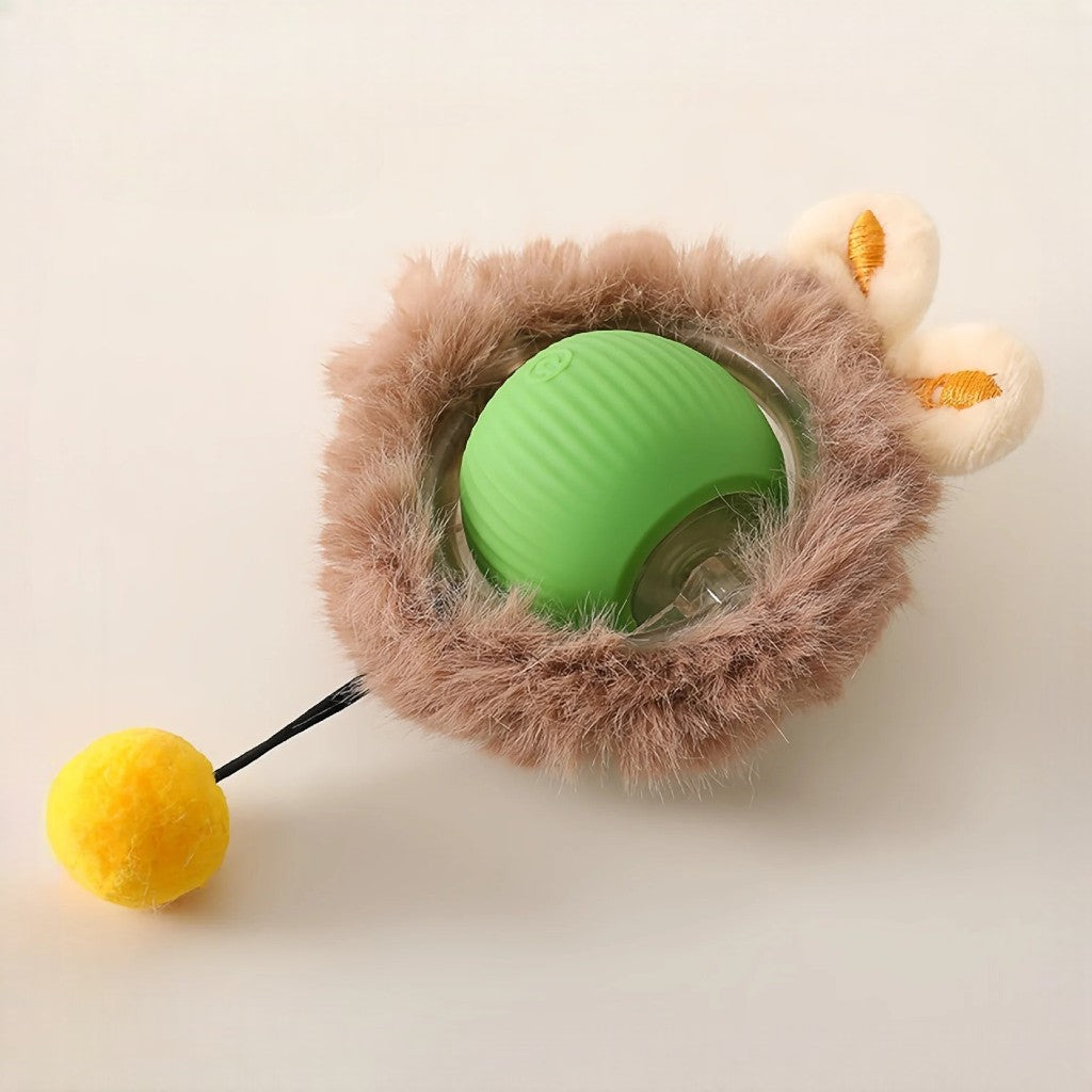 Balle électrique interactive Esprit Chat en caoutchouc vert avec une boule jaune et une bordure en fausse fourrure marron.