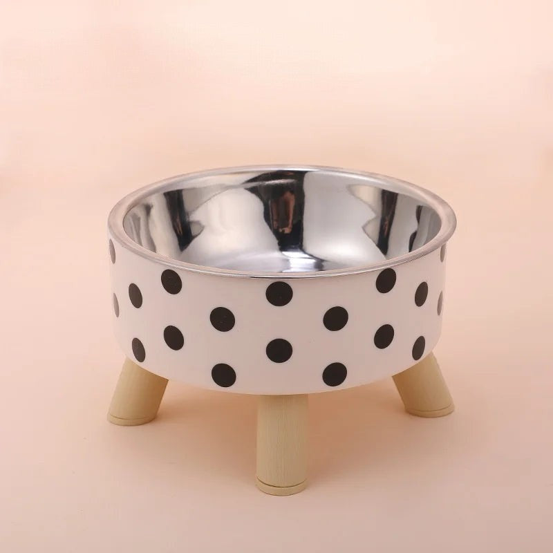 Bol pour chat Esprit Chat en acier inoxydable avec motif à pois noirs sur fond blanc et pieds en bois clair