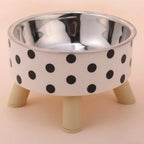 Bol pour chat Esprit Chat en acier inoxydable avec motif à pois noirs sur fond blanc et pieds en bois