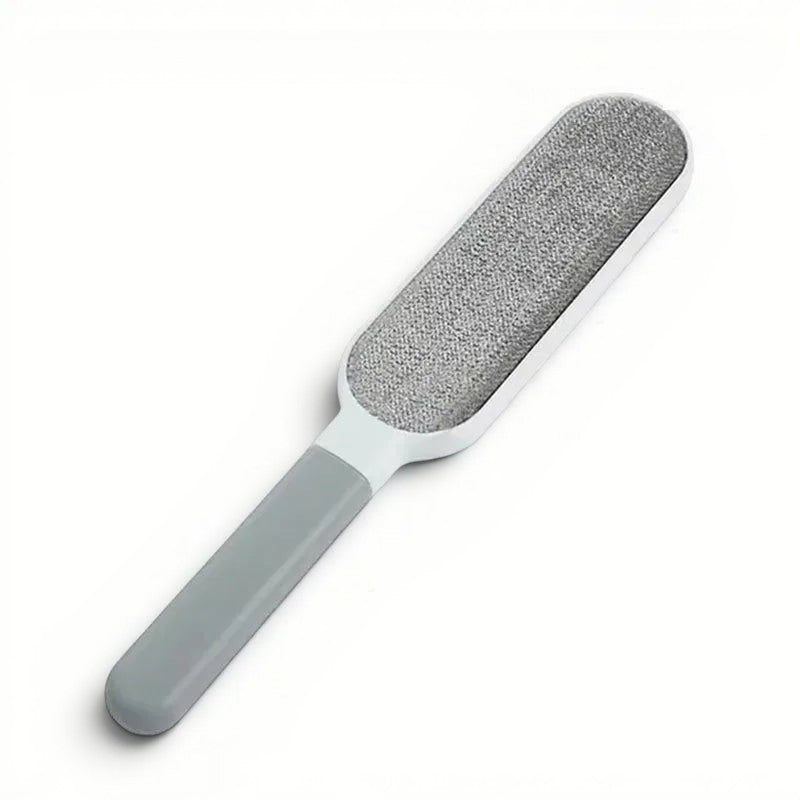 Brosse anti-poils Esprit Chat grise et blanche pour le toilettage et l'entretien des textiles