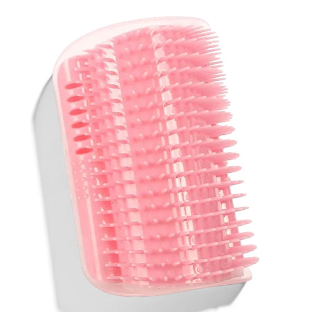 Brosse de massage Esprit Chat en plastique rose pour chat, conçue pour être fixée aux coins des murs pour le toilettage.