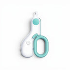 Coupe-griffes Esprit Chat blanc et bleu avec éclairage LED intégré pour une coupe sécurisée des griffes de chiens.