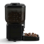 Distributeur de croquettes Esprit Chat noir automatique avec chat roux mangeant dans une gamelle ergonomique