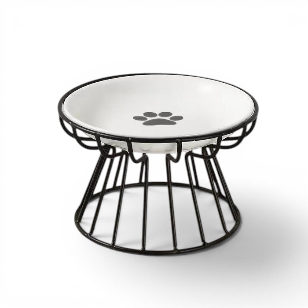Gamelle Esprit Chat en céramique blanche avec motif patte, sur support en métal noir, design ergonomique pour chat.