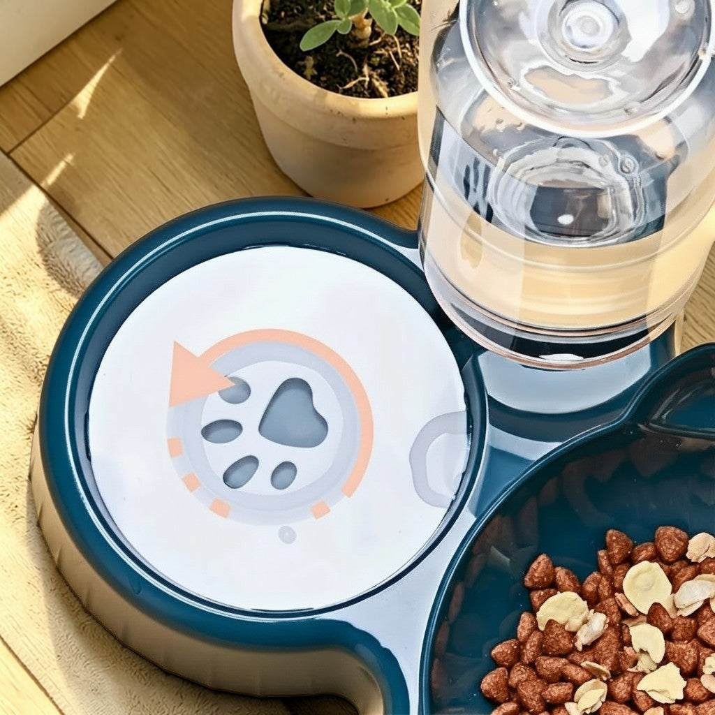Gamelle ergonomique Esprit Chat en plastique bleu foncé avec distributeur d'eau intégré et motif empreinte de patte.