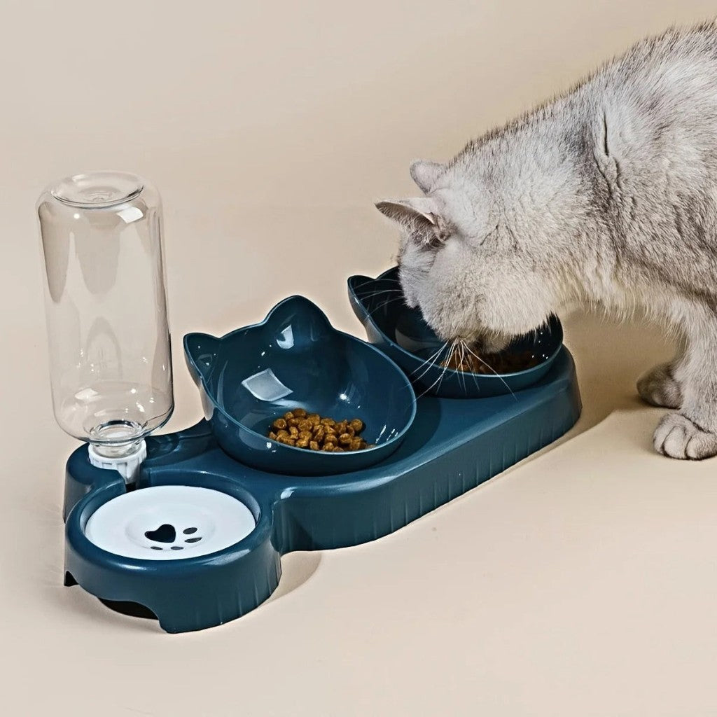 Gamelle ergonomique bleu canard en plastique pour chat, avec distributeur d'eau intégré et forme de tête de chat.