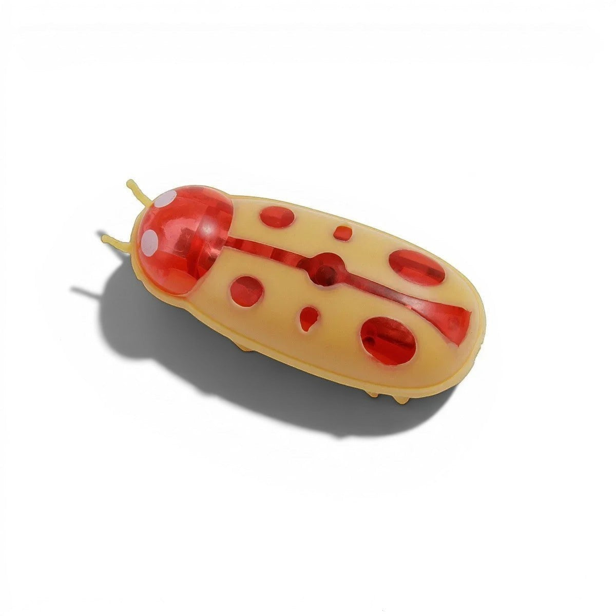 Jouet Esprit Chat insecte électrique en plastique jaune et rouge, avec des points rouges et des antennes.