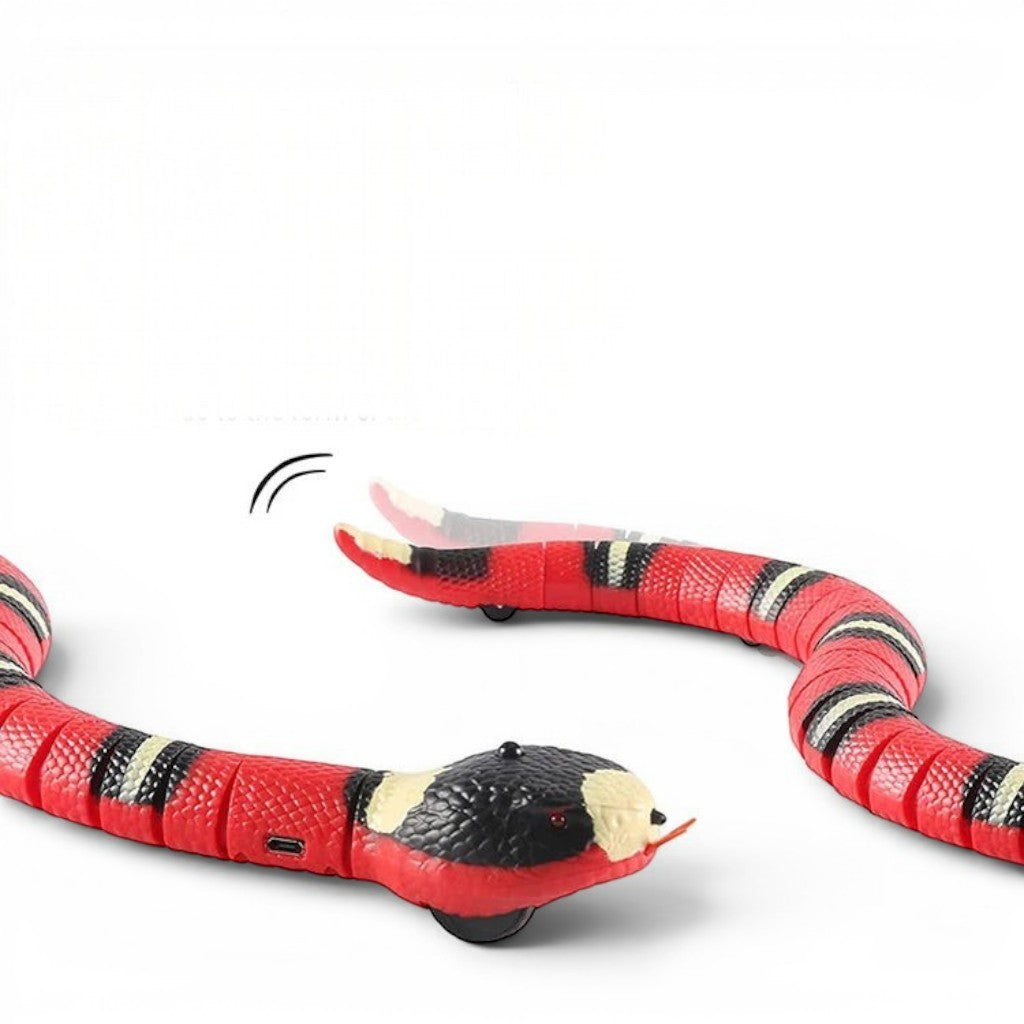 Esprit Chat jouet serpent interactif en plastique rouge et noir, avec yeux clignotants et langue sortie.