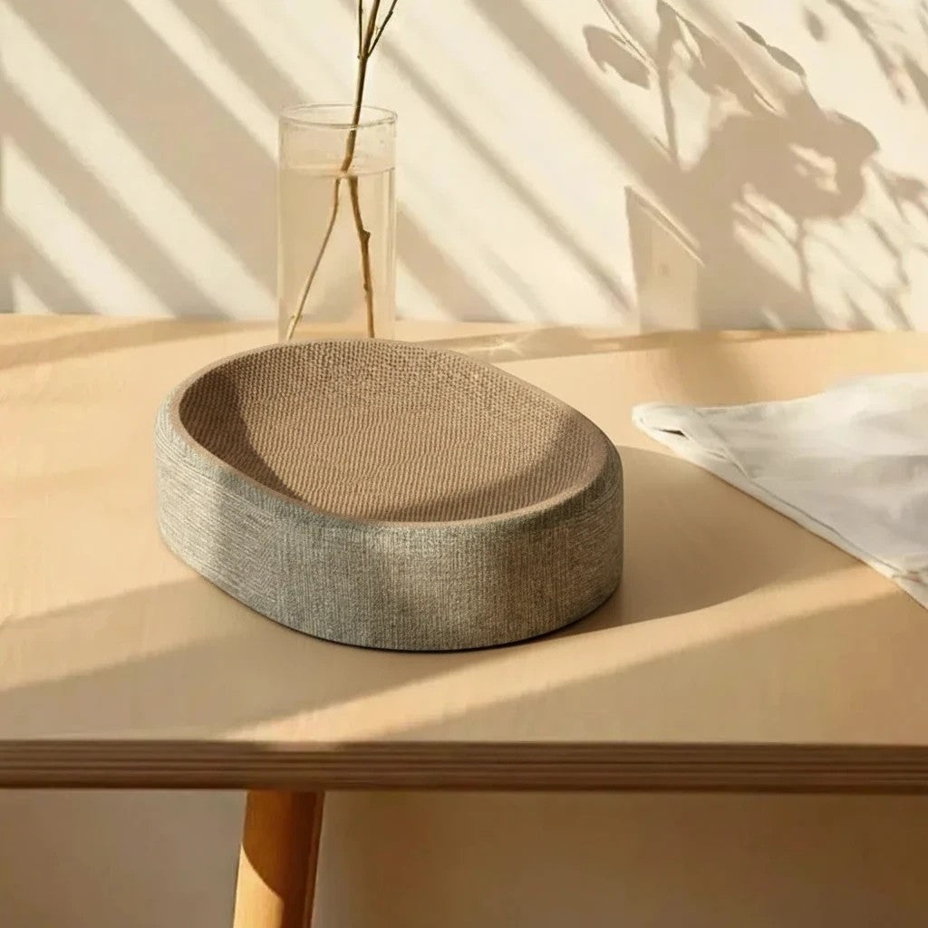 Lit griffoir Esprit Chat ovale en sisal beige avec bordure grise, design moderne pour le repos et le grattage du chat
