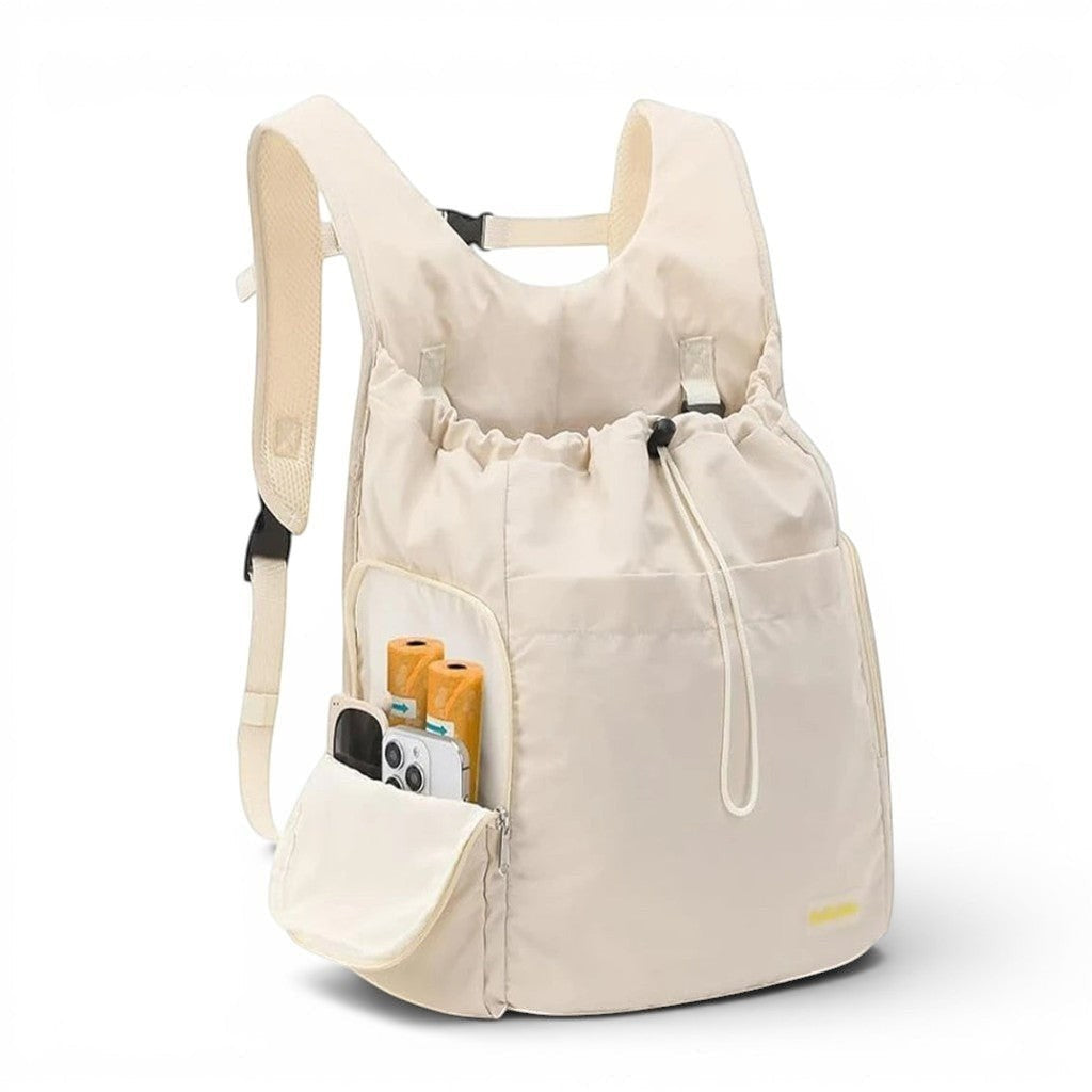 Sac de transport Esprit Chat beige souple pour chat, style sac à dos avec poches latérales pratiques pour accessoires.